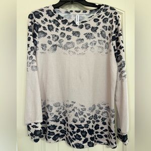 Tickled Teal (boutique brand) blush colored animal print shirt. Sz S